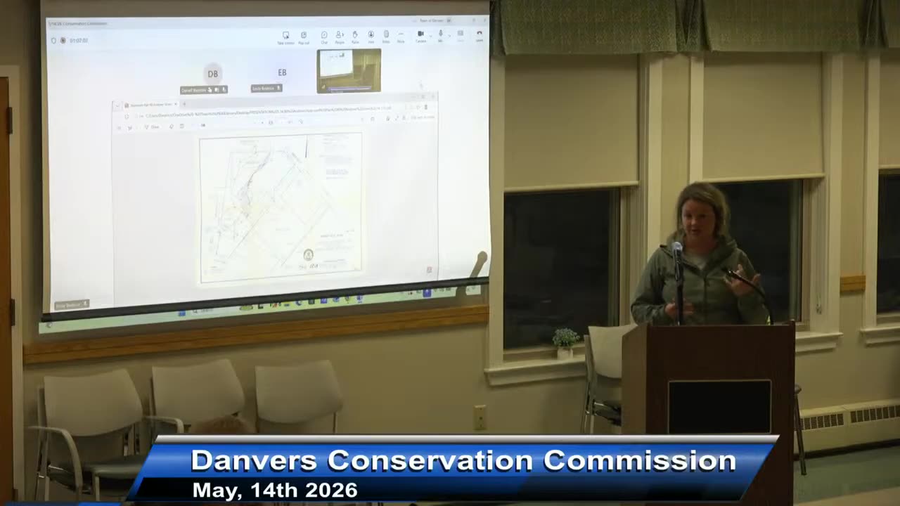 Projected site layout diagram during meeting