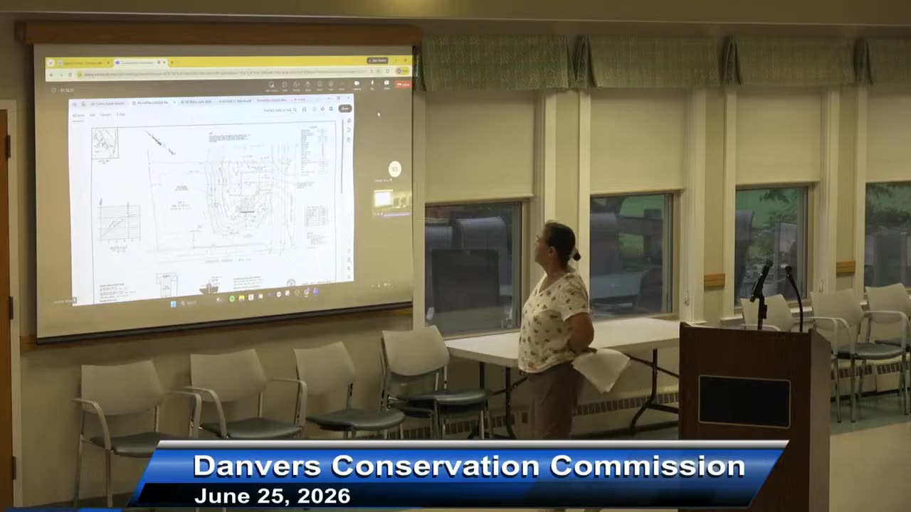 Detailed site plan displayed on projector screen
