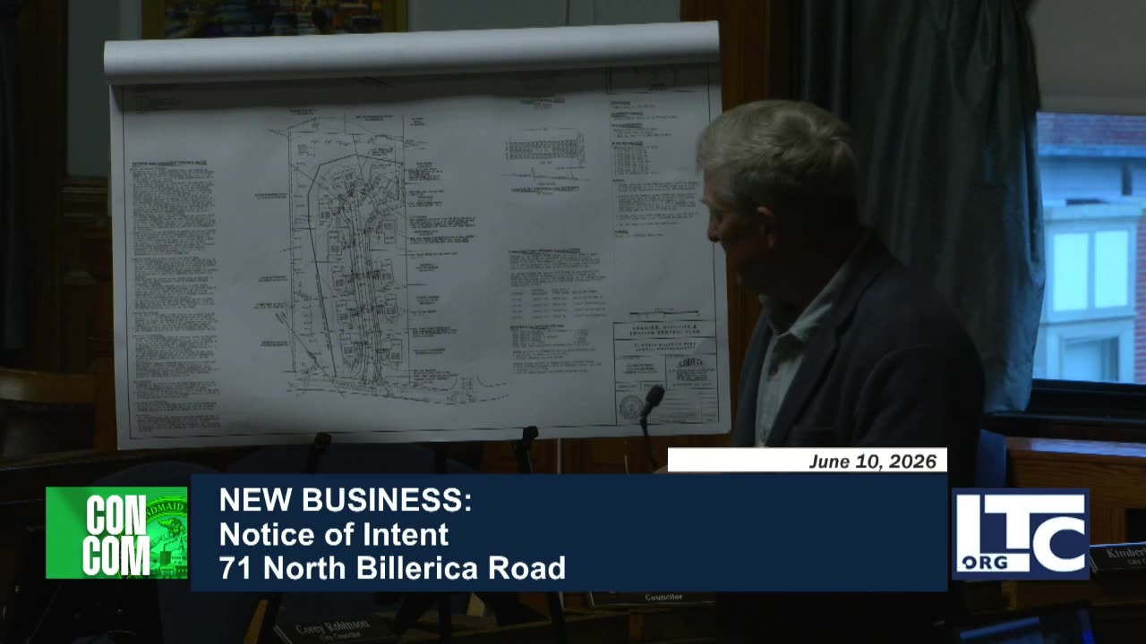 Large-scale site plan and subdivision drawings on easel