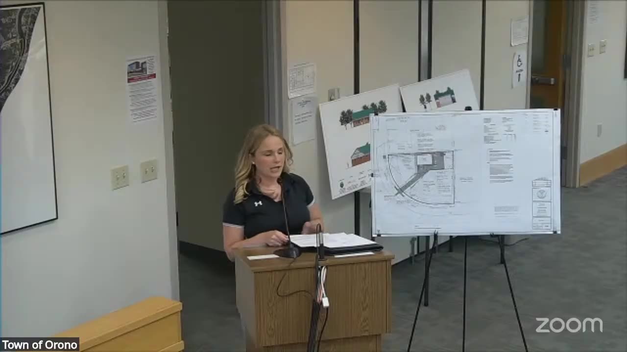 Presenter at podium with large legible site plan and architectural renderings on easels