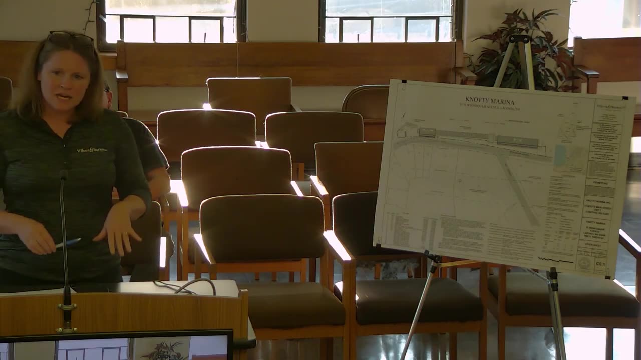 Knotty Marina site plan displayed on easel during presentation