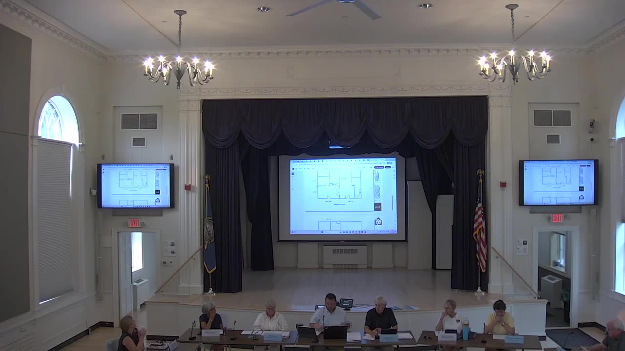 Floor plan displayed on large central screen and side monitors