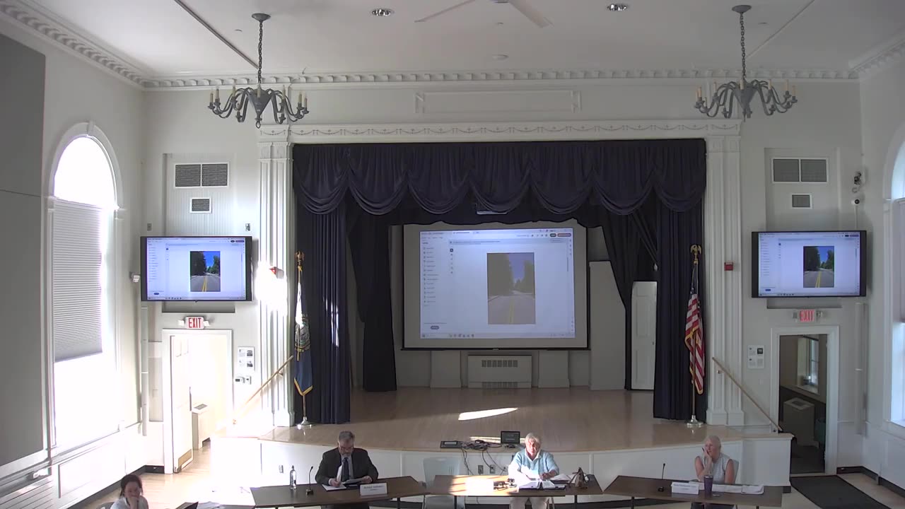 Presentation slide showing road site photo