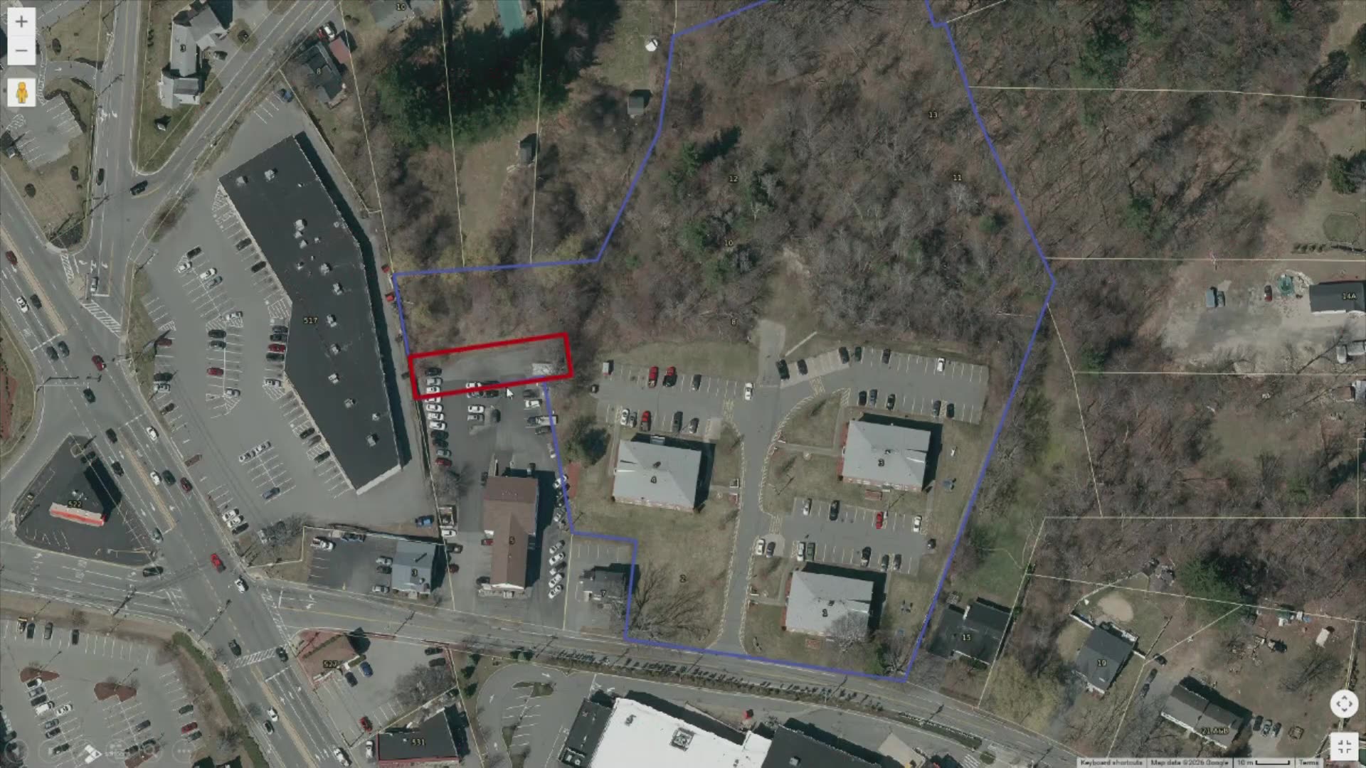 Aerial site map with highlighted parcels and parking areas